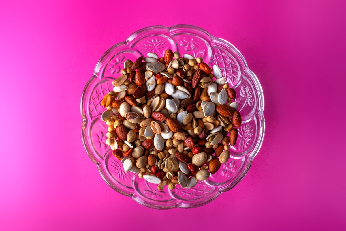Mixed nuts, seeds, and dried fruits on a wooden board